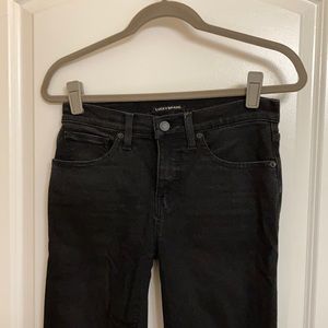 Distressed black skinny jeans